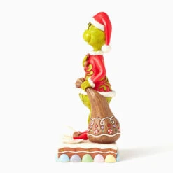 Enesco Jim Shore Grinch With Presents Eating Gingerbread Figurine, 8" 12 Enesco Jim Shore Grinch With Presents Eating Gingerbread Figurine, 8" -Hallmark Store Jim Shore Grinch With Gifts and Gingerbread Figurine 6017058 05