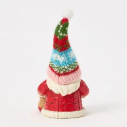 Enesco Jim Shore Heartwood Creek Holiday Gnome In Knit Hat Figurine, 5.71" 7 Enesco Jim Shore Heartwood Creek Holiday Gnome In Knit Hat Figurine, 5.71" -Hallmark Store Jim Shore Santa Gnome With Colorful Knit Hat Figurine 6017285 02