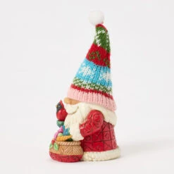 Enesco Jim Shore Heartwood Creek Holiday Gnome In Knit Hat Figurine, 5.71" 8 Enesco Jim Shore Heartwood Creek Holiday Gnome In Knit Hat Figurine, 5.71" -Hallmark Store Jim Shore Santa Gnome With Colorful Knit Hat Figurine 6017285 03
