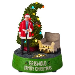 Hallmark National Lampoon's Christmas Vacation™ Griswold Family Christmas Figurine With Light And Sound, 7.75" H 11 Hallmark National Lampoon's Christmas Vacation™ Griswold Family Christmas Figurine With Light And Sound, 7.75" H -Hallmark Store LightUp Clark Griswold Tree and Chair Figurine 1XKT6145 03