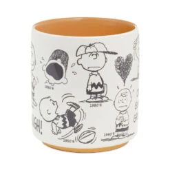 Hallmark Peanuts® 75th Anniversary Charlie Brown Through The Decades Mug, 17.5 Oz. 11 Hallmark Peanuts® 75th Anniversary Charlie Brown Through The Decades Mug, 17.5 Oz. -Hallmark Store Peanuts 75th Anniversary Charlie Brown Mug 1PAJ4714 03