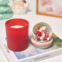 Red Peppermint Scented Santa And Mrs. Claus Snow Globe Candle 10 Red Peppermint Scented Santa And Mrs. Claus Snow Globe Candle -Hallmark Store Red Peppermint Candle Santa and Mrs. Claus Snow Globe HMSNWGLB2 04