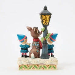 Enesco Jim Shore Rudolph And Elves Caroling Light-Up Figurine, 8.4" 9 Enesco Jim Shore Rudolph And Elves Caroling Light-Up Figurine, 8.4" -Hallmark Store Rudolph the RedNosed Reindeer LightUp Figurine 6017191 03